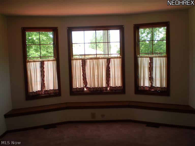 30509 Ridge Road Wickliffe, OH 44092 - Photo 11 of 24 The first floor family room features built in seating that has that little bit of extra storage underneath