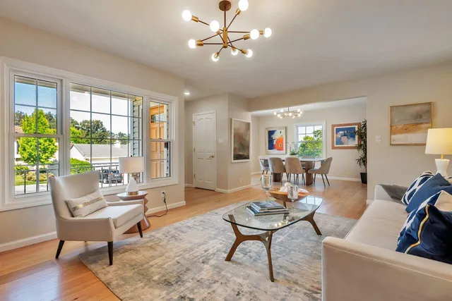 a view of a deck with table and chairs with wooden floor and fence