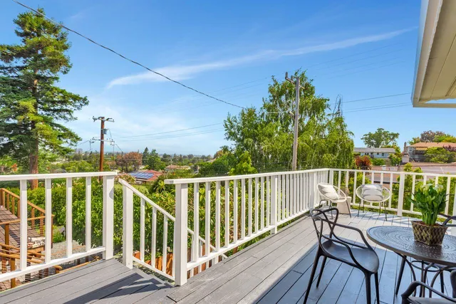 a spacious bedroom with a bed and a couch