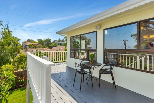 a bedroom with a bed and a lamp with window