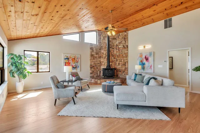 a bedroom with two beds and a large window
