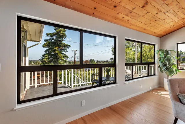 a bedroom with a bed and painting on the wall