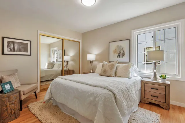 an aerial view of residential houses with city view