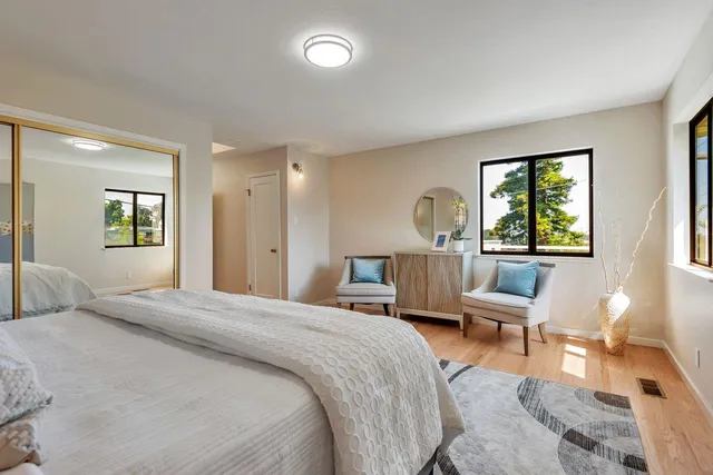 an aerial view of residential houses with city view