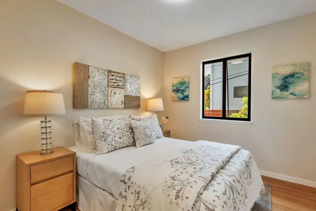 an aerial view of residential houses with outdoor space and parking