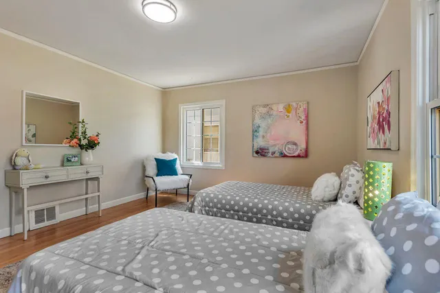 an aerial view of a houses with a street