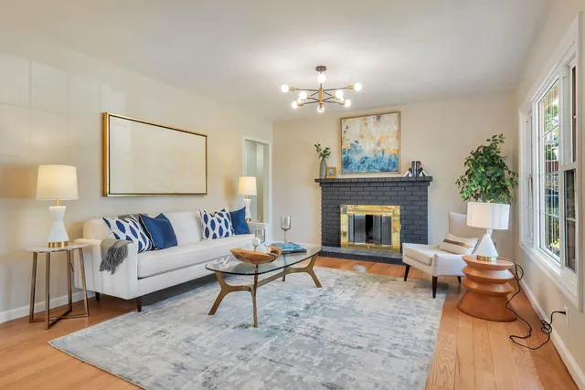 a kitchen with stainless steel appliances white cabinets and a refrigerator