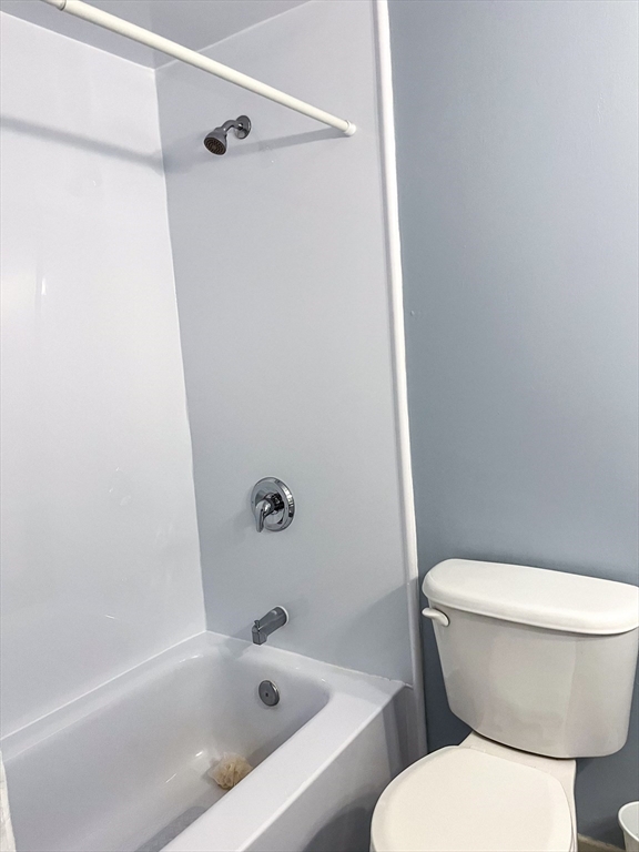 57 Will Drive, Unit 168 Canton, MA 02021 - Photo 12 of 15 a white toilet sitting next to a bath tub