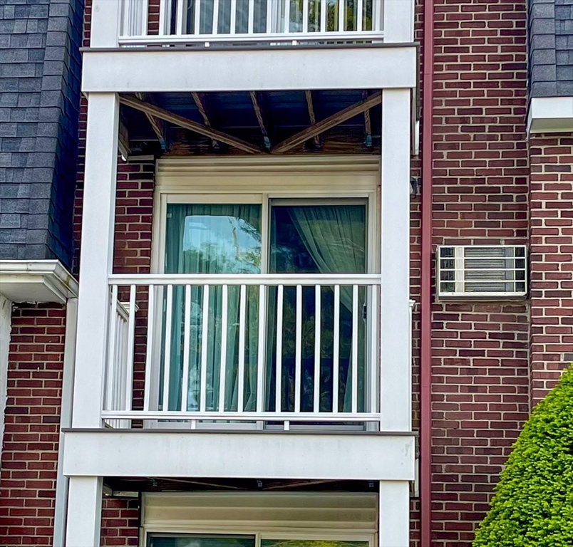 57 Will Drive, Unit 168 Canton, MA 02021 - Photo 13 of 15 a view of a house with porch and deck