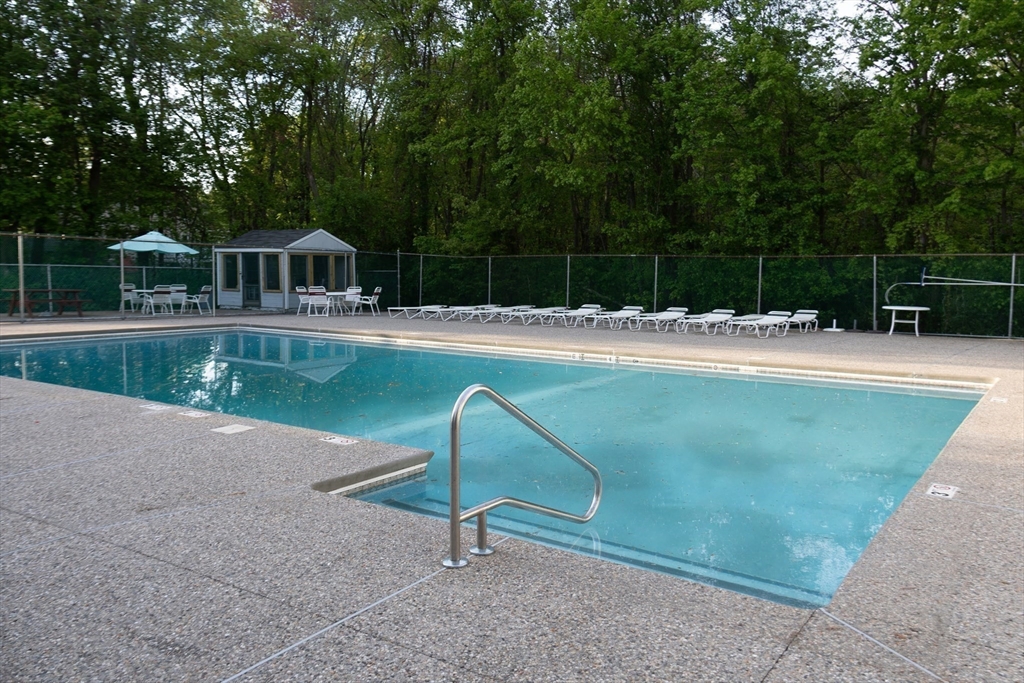 57 Will Drive, Unit 168 Canton, MA 02021 - Photo 14 of 15 a view of a house with pool and a yard