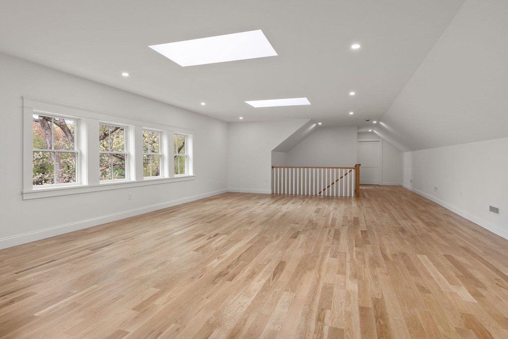 82 Deer Path Lane Weston, MA 02493 - Photo 30 of 42 a view of empty room with wooden floor and fan