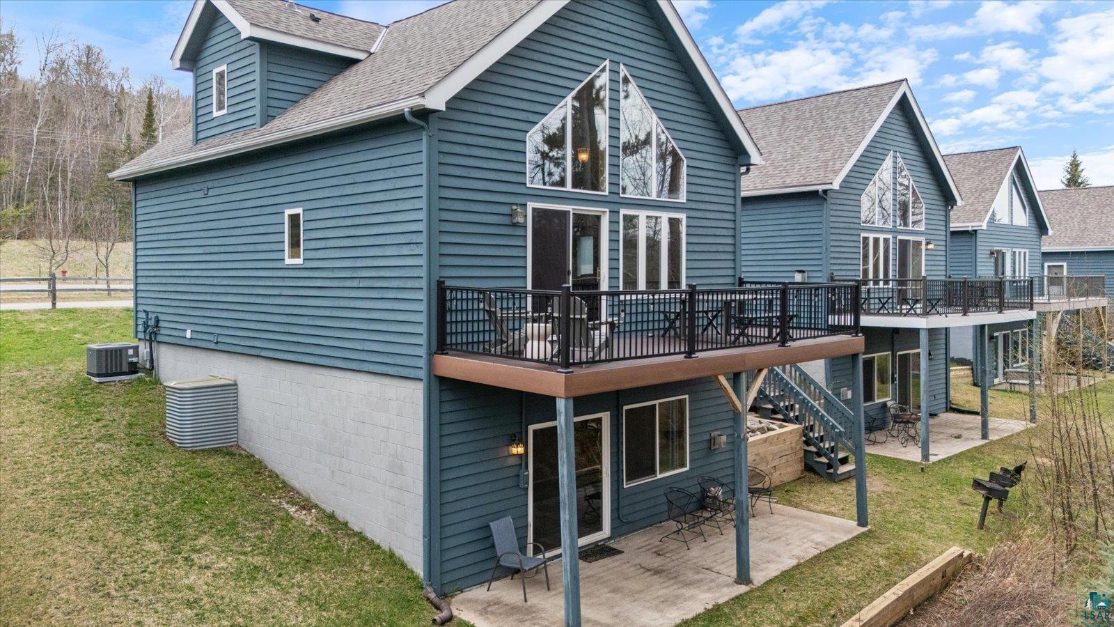 6266 Giants Ridge Road Biwabik, MN 55705 - Photo 2 of 37 Multi-level residential unit with blue horizontal siding
