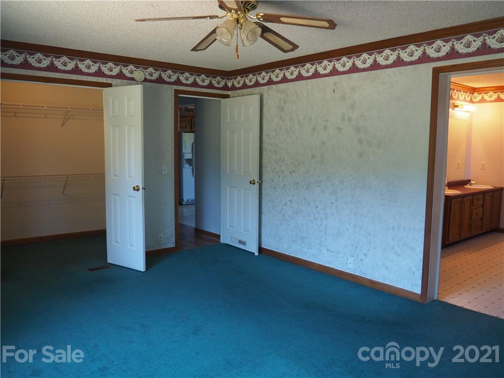 1201 Goldmine Road Chester, SC 29706 - Photo 6 of 30 a view of a room with wooden floor and windows