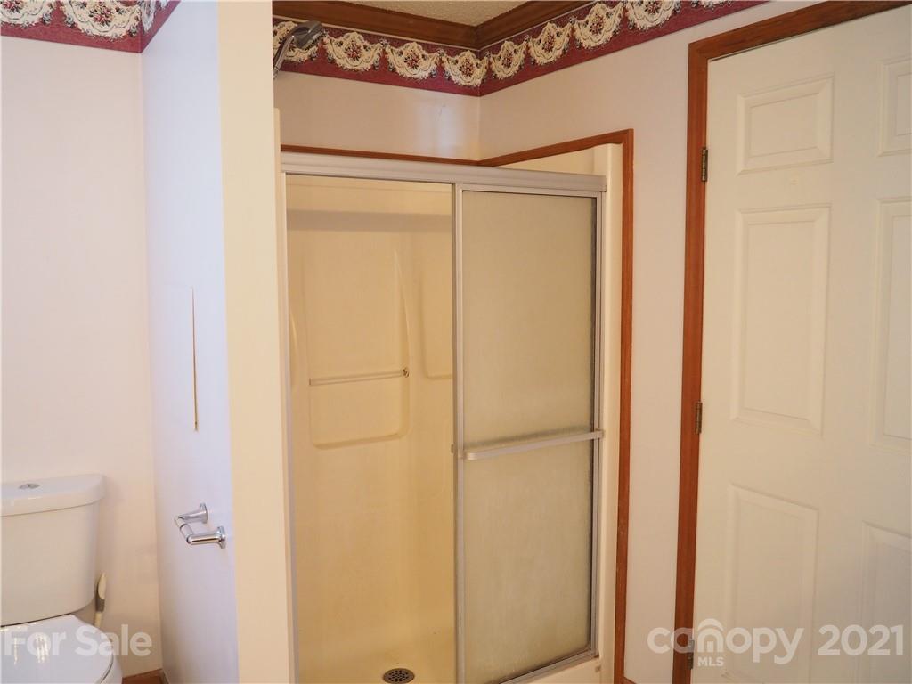 1201 Goldmine Road Chester, SC 29706 - Photo 9 of 30 a bathroom with a shower and a toilet