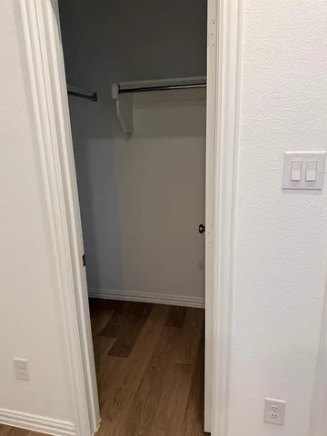 a view of a house with a wooden deck and a big yard