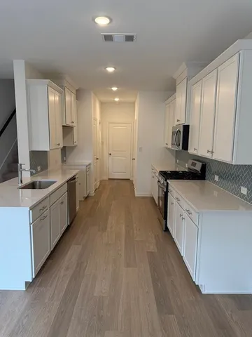 a large kitchen with a lot of counter space