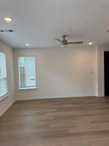 a view of an empty room with a window