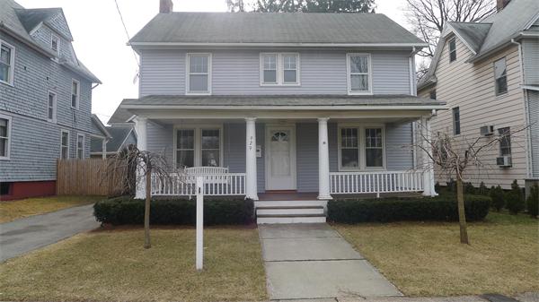 a view of a house with a window and chair