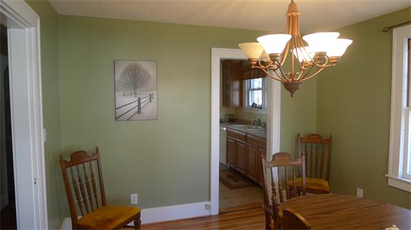 929 Sumner Avenue Springfield, MA 01118 - Photo 13 of 29 a view of a hallway with wooden floor staircase and living room