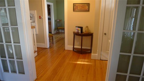 929 Sumner Avenue Springfield, MA 01118 - Photo 25 of 29 a view of a hallway with wooden floor and staircase