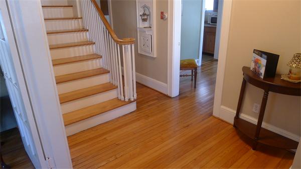 929 Sumner Avenue Springfield, MA 01118 - Photo 27 of 29 a view of a hallway with wooden floor and staircase
