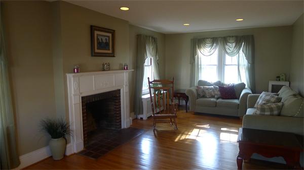 929 Sumner Avenue Springfield, MA 01118 - Photo 9 of 29 a living room with furniture and a fireplace
