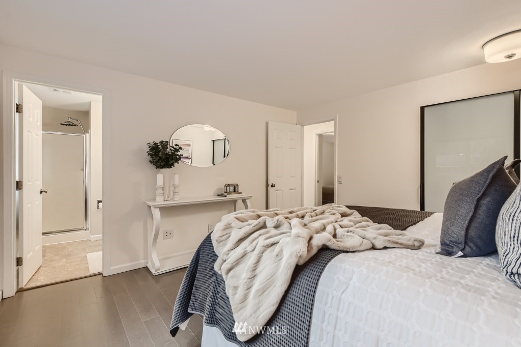 3301 198th Place Southeast Bothell, WA 98012 - Photo 13 of 35 a bedroom with a bed and a mirror