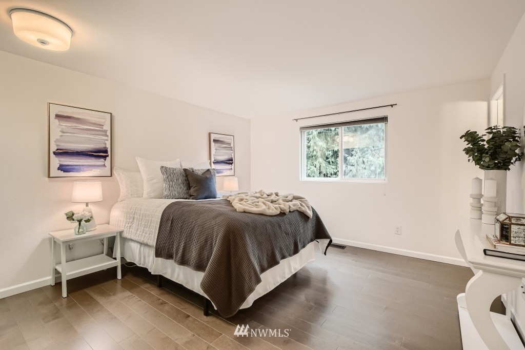 3301 198th Place Southeast Bothell, WA 98012 - Photo 15 of 35 a spacious bedroom with a bed and a window