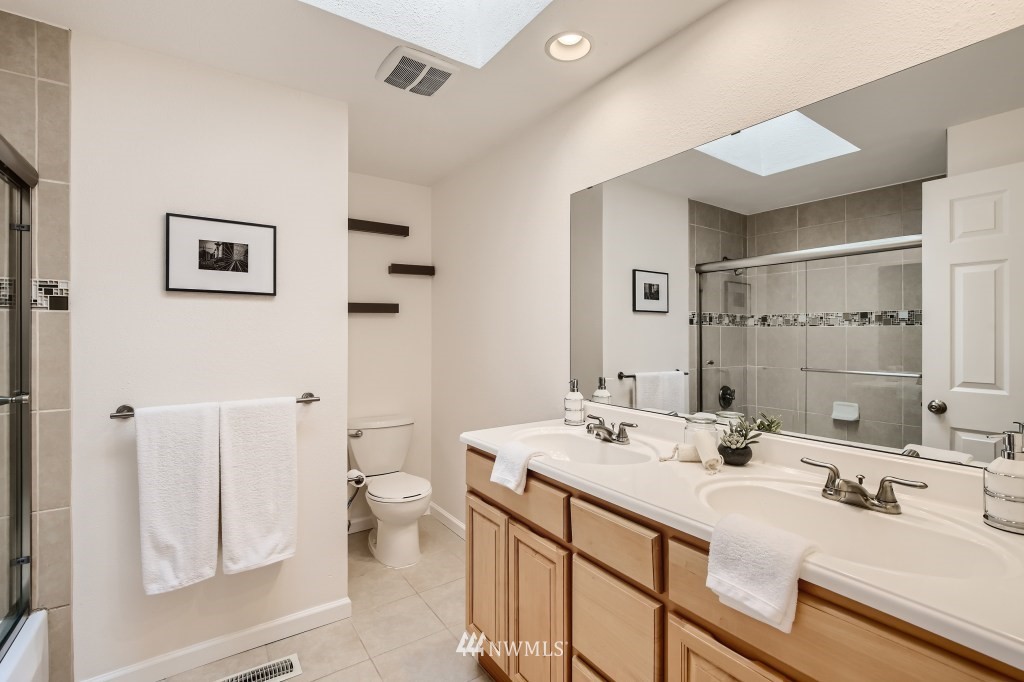 3301 198th Place Southeast Bothell, WA 98012 - Photo 20 of 35 a bathroom with a double vanity sink mirror and toilet