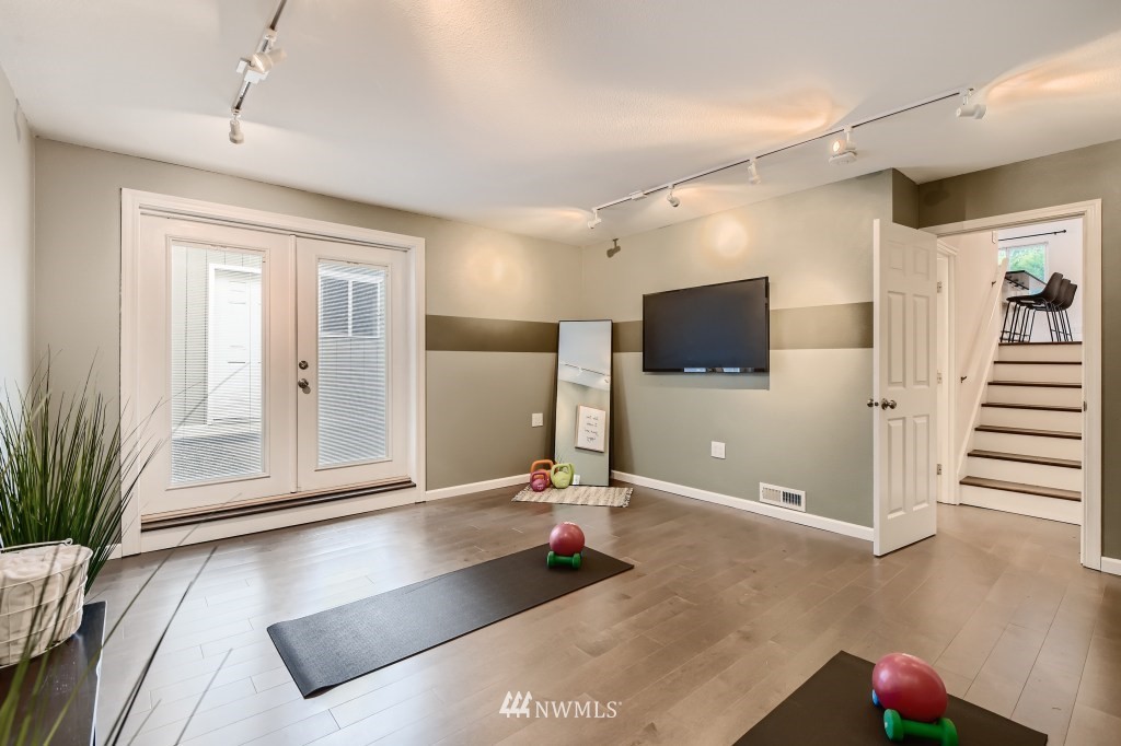 3301 198th Place Southeast Bothell, WA 98012 - Photo 22 of 35 a living room with furniture and a flat screen tv