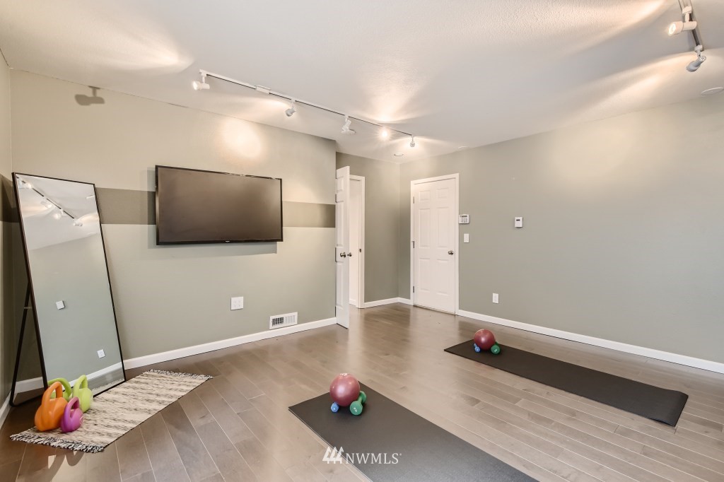 3301 198th Place Southeast Bothell, WA 98012 - Photo 23 of 35 a living room with furniture and a flat screen tv