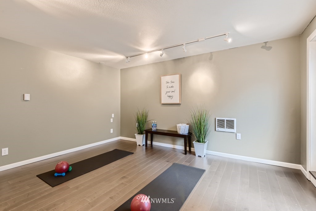 3301 198th Place Southeast Bothell, WA 98012 - Photo 24 of 35 a living room with furniture and wooden floor