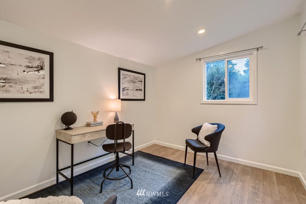3301 198th Place Southeast Bothell, WA 98012 - Photo 27 of 35 a living room with furniture and a window