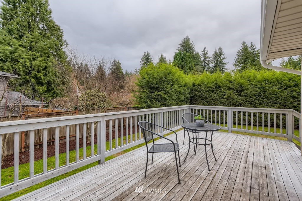 3301 198th Place Southeast Bothell, WA 98012 - Photo 29 of 35 a view of balcony with wooden floor and fence