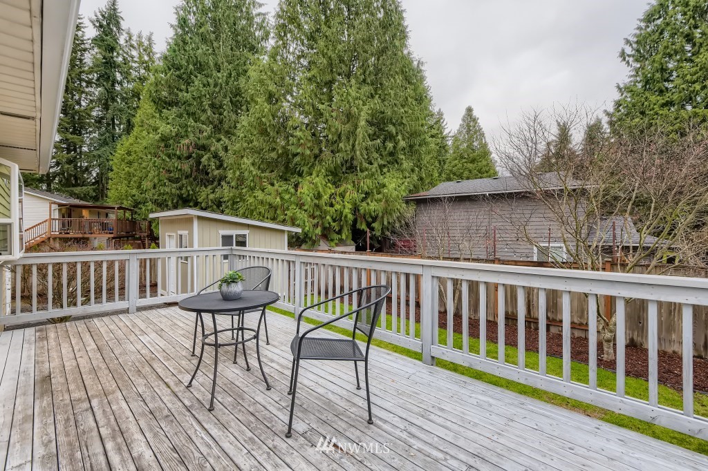3301 198th Place Southeast Bothell, WA 98012 - Photo 30 of 35 a view of a chair and table on the wooden floor