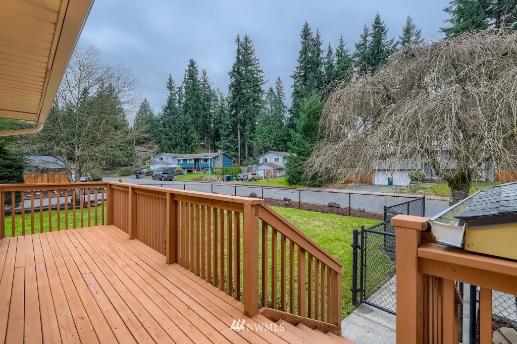 3301 198th Place Southeast Bothell, WA 98012 - Photo 4 of 35 a view of a balcony with wooden floor and fence