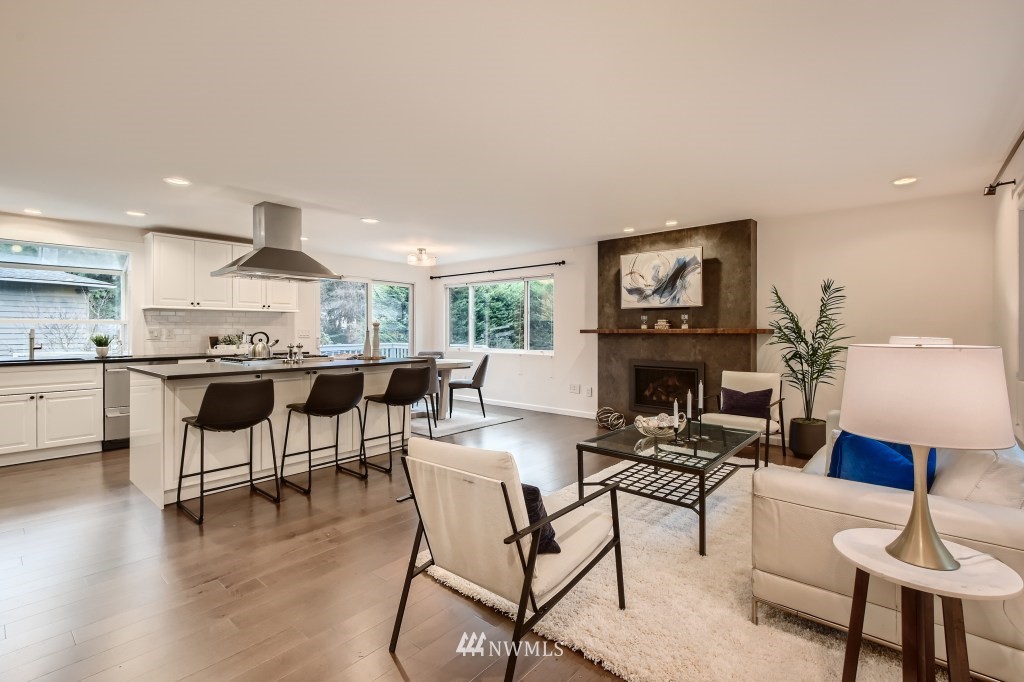 3301 198th Place Southeast Bothell, WA 98012 - Photo 5 of 35 a kitchen with a table chairs and a living room