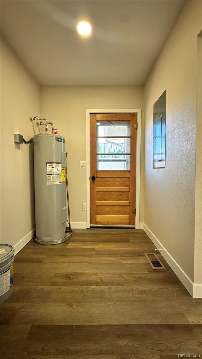 215 6th Street Hugo, CO 80821 - Photo 24 of 28 a view of a room with a wooden floor