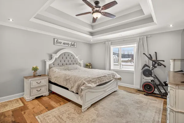 a spacious bedroom with a bed and a window