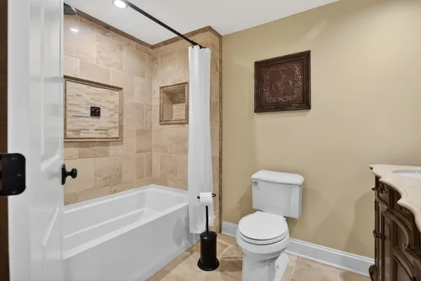 a bathroom with a toilet and a bathtub