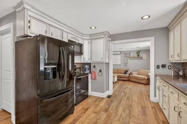 a kitchen with stainless steel appliances a refrigerator and a sink