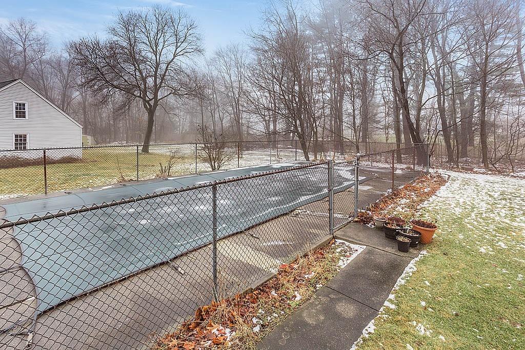 25 Garland Road Chelmsford, MA 01824 - Photo 20 of 25 a view of a backyard with large trees