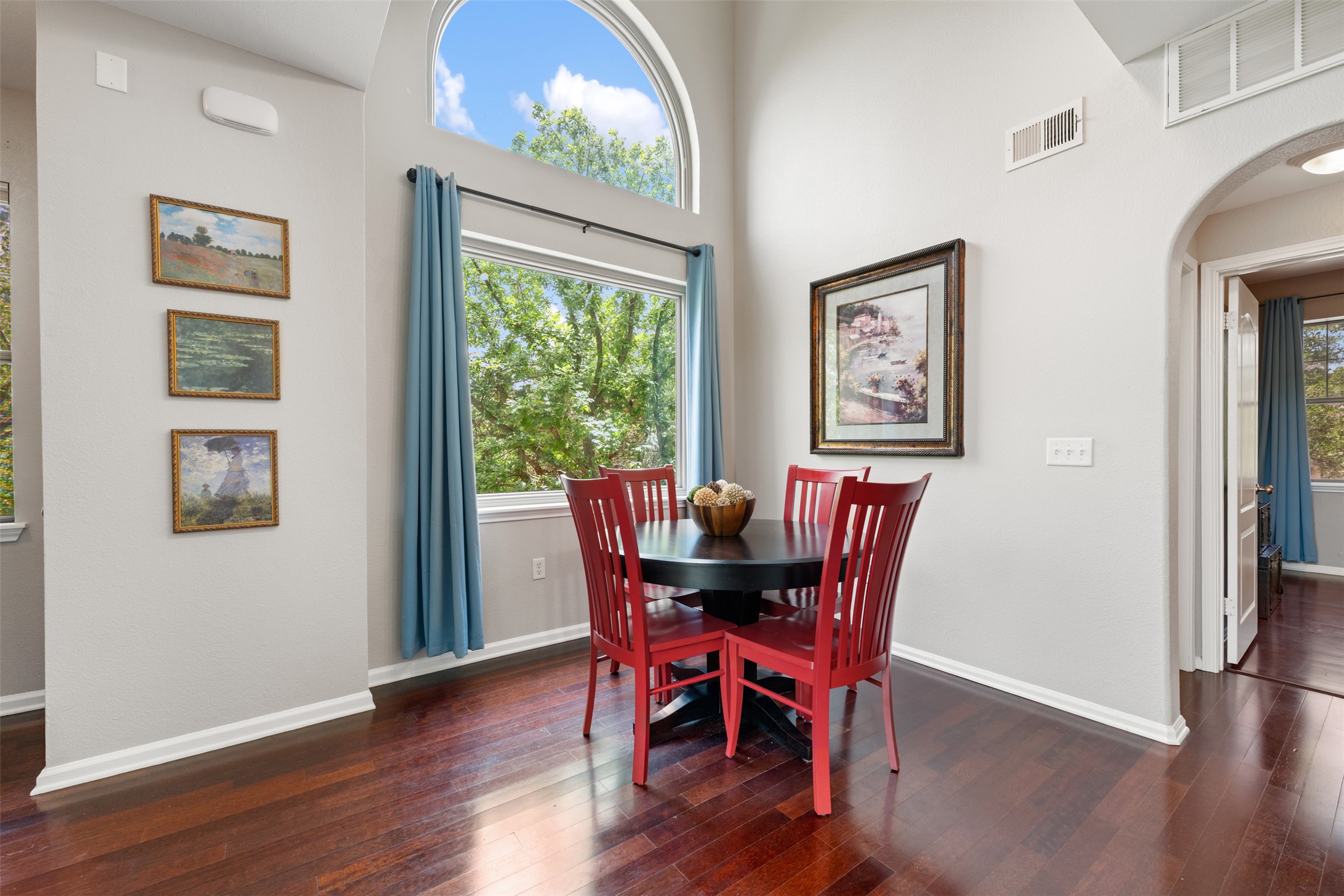 11203 Ranch Road 2222, Unit 1407 Austin, TX 78732 - Photo 28 of 40 The dining area sits under soaring vaulted ceilings and alongside oversized Renewal by Anderson windows.