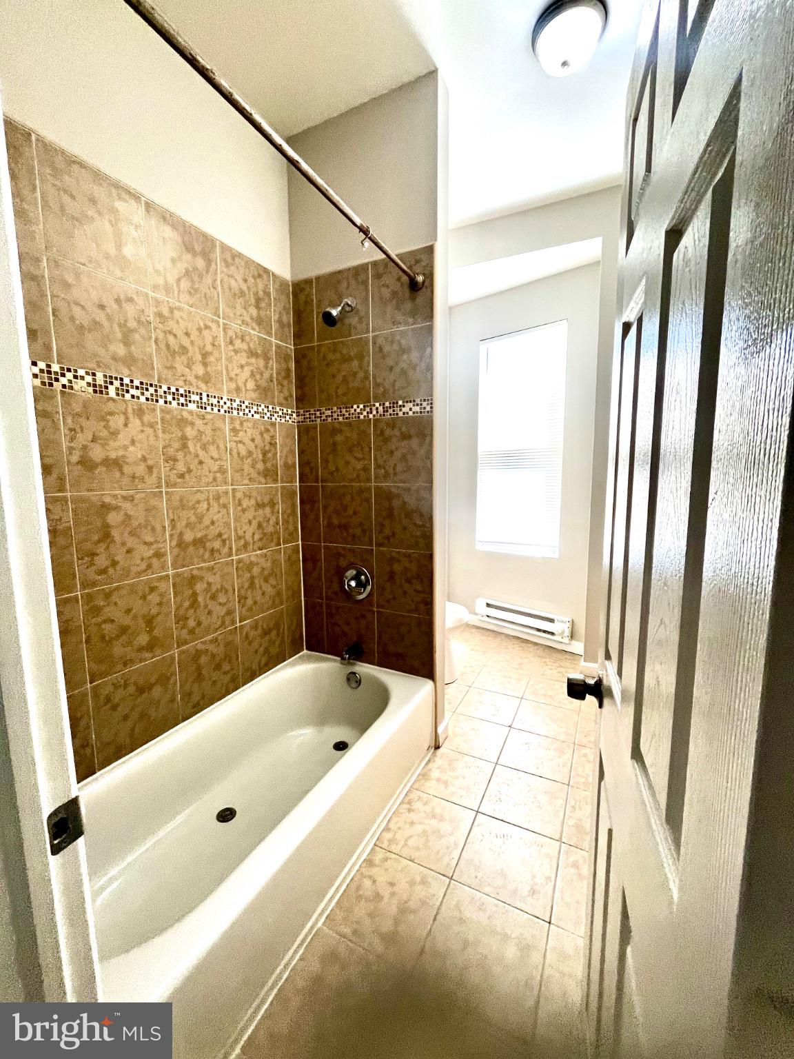 7106 Devon Street, Unit 1 Philadelphia, PA 19119 - Photo 6 of 11 Modern bathroom with elegant tiles.