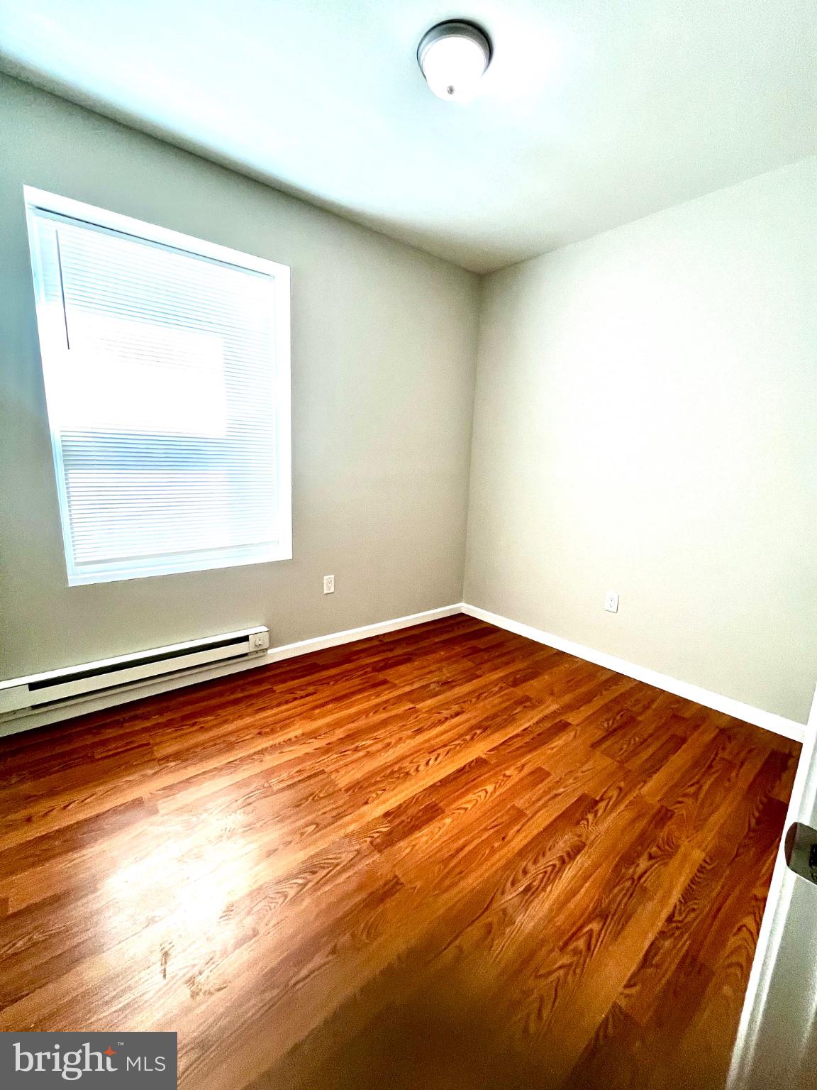 7106 Devon Street, Unit 1 Philadelphia, PA 19119 - Photo 9 of 11 Bright and airy room with hardwood floors.