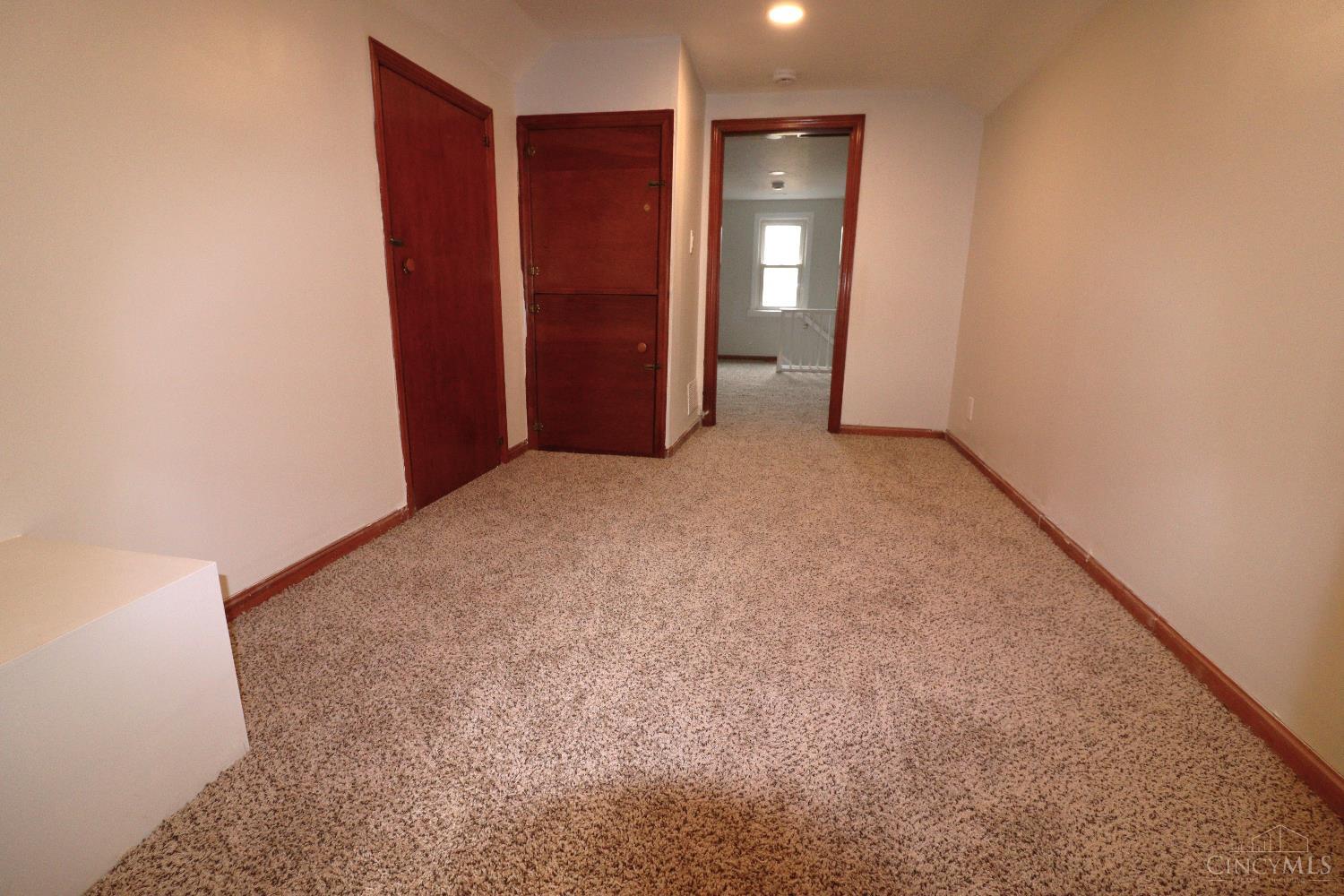 4731 Shephard Road Batavia, OH 45103 - Photo 23 of 25 middle room of upper story floor, looking towards stairs railing. Freshly painted and new carpet.