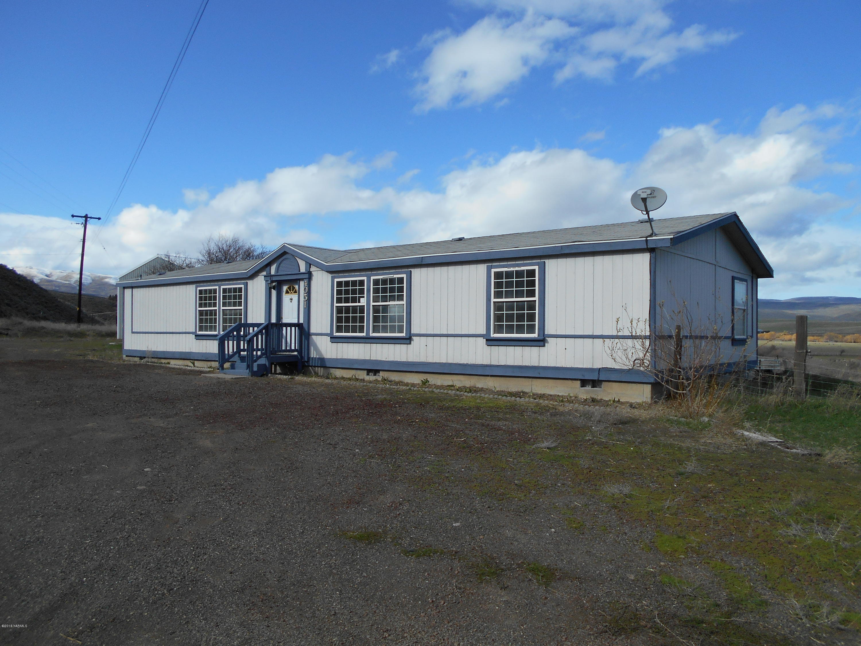 4051 Wenas Road South Selah, WA 98942 - Photo 1 of 21 a view of a house with backyard