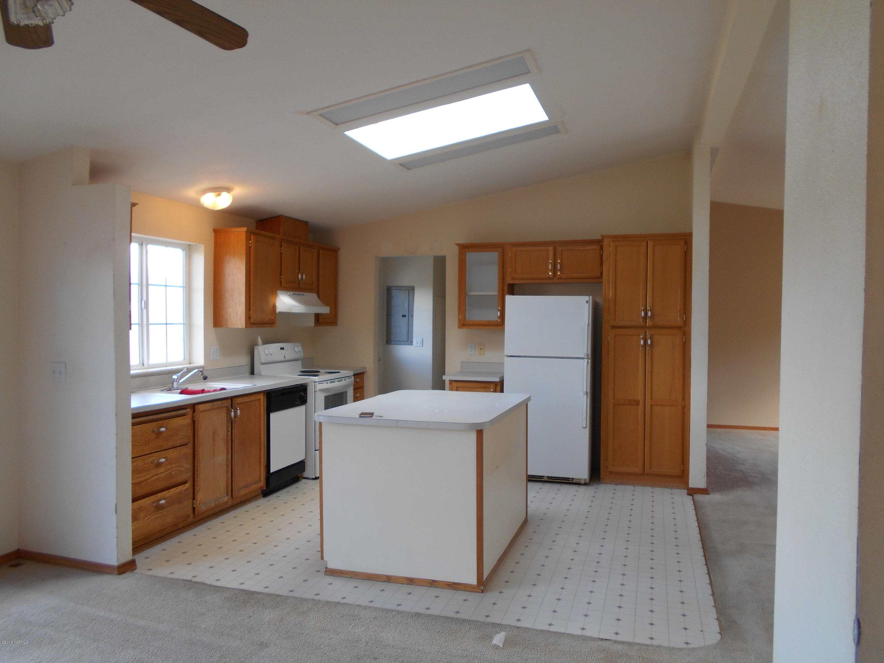 4051 Wenas Road South Selah, WA 98942 - Photo 5 of 21 a kitchen with a sink a stove and refrigerator