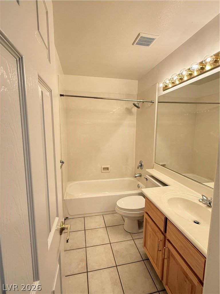 10975 Calcedonian Street Las Vegas, NV 89141 - Photo 12 of 25 This bathroom features a combined tub and shower, a classic vanity, and tiled flooring.