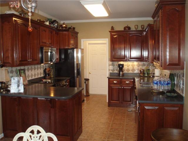 7112 Deer Ridge Road Fairview, TN 37062 - Photo 6 of 20 Great kitchen with lots of cupboard space and the gorgeous cherry wood